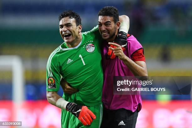 Egypt's goalkeeper Essam El-Hadary celebrates with Egypt's goalkeeper Ahmed El-Shenawy at the end of the penalty shootout of the 2017 Africa Cup of...