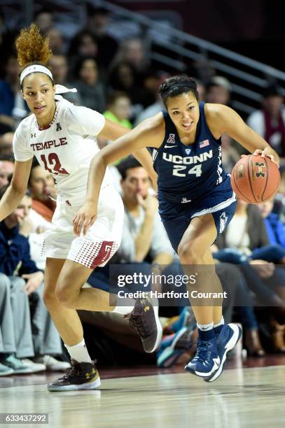 Connecticut's Napheesa Collier pushes the ball up court after making a steal on Temple's forward Ruth Sherrill during the first half on Wednesday,...