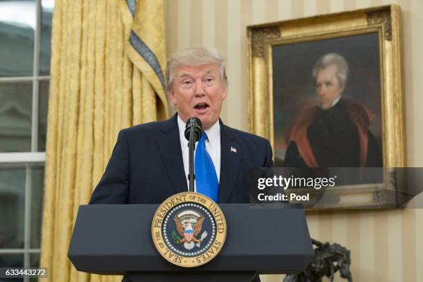 President Donald Trump, beneath a portrait of populist President Andrew Jackson, speaks before the swearing-in of Rex Tillerson as 69th secretary of...