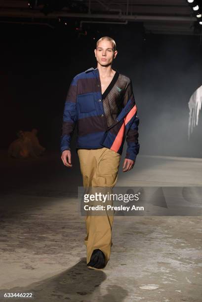 Model walks the runway at the Rochambeau NYFW: Men's show at Skylight Clarkson North on February 1, 2017 in New York City.