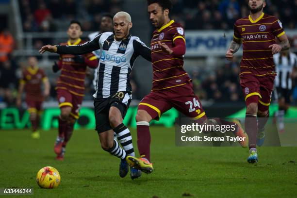 Yoan Gouffran of Newcastle United and James Perch of Queens Park Rangers jostle for the ball during the Sky Bet Championship match between Newcastle...