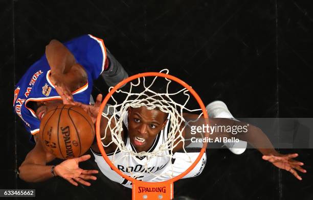 Isaiah Whitehead of the Brooklyn Nets rebounds against Justin Holiday of the New York Knicks during their game at the Barclays Center on February 1,...