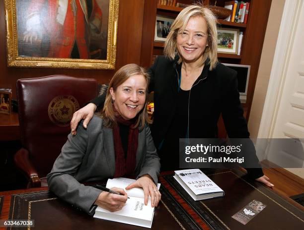 Author Lisa Dickey poses for a photo with Hilary Rosen at a book-signing reception for her new book "Bears in the Streets: Three Journeys Across a...