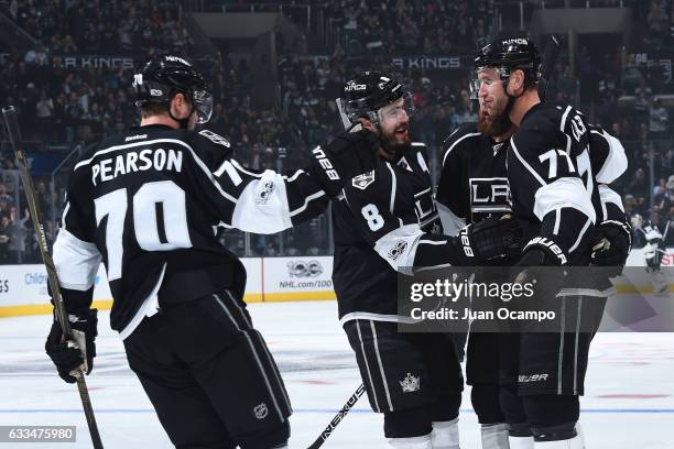 Tanner Pearson, Drew Doughty, Jake Muzzin, and Jeff Carter of the Los Angeles Kings celebrate during a game against the Colorado Avalanche at STAPLES...