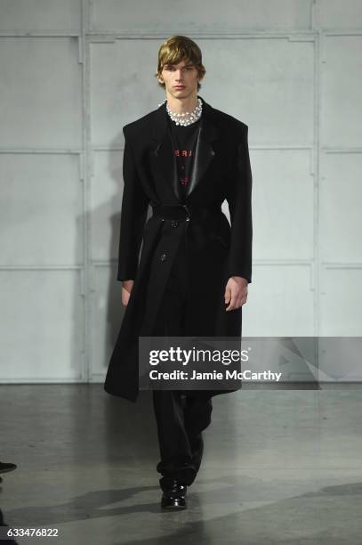 Model walks the runway at the Raf Simons fashion show during NYFW: Men'son February 1, 2017 in New York City.