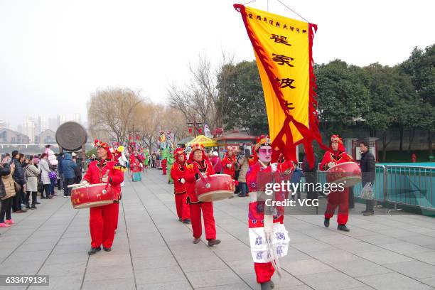 Folk performers parade during a celebration of Lunar New Year at Tang Paradise on February 1, 2017 in Xi'an, Shaanxi Province of China. Stilts...