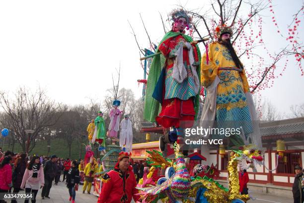 Folk artists walk on stilts during a celebration of Lunar New Year at Tang Paradise on February 1, 2017 in Xi'an, Shaanxi Province of China. Stilts...
