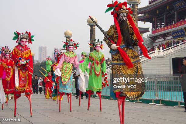 Folk artists walk on stilts during a celebration of Lunar New Year at Tang Paradise on February 1, 2017 in Xi'an, Shaanxi Province of China. Stilts...