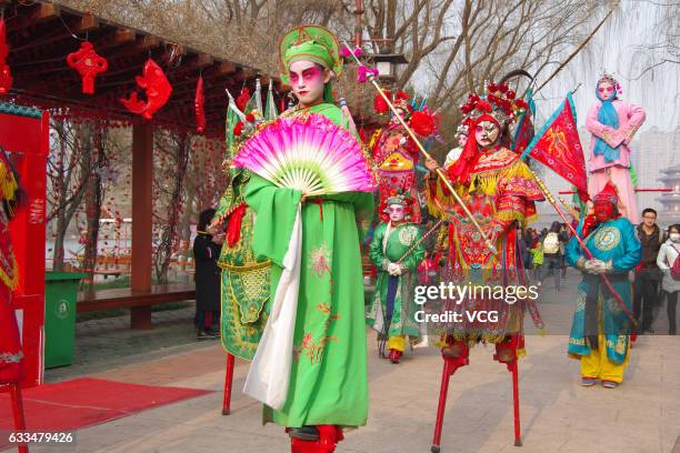 Folk artists walk on stilts during a celebration of Lunar New Year at Tang Paradise on February 1, 2017 in Xi'an, Shaanxi Province of China. Stilts...