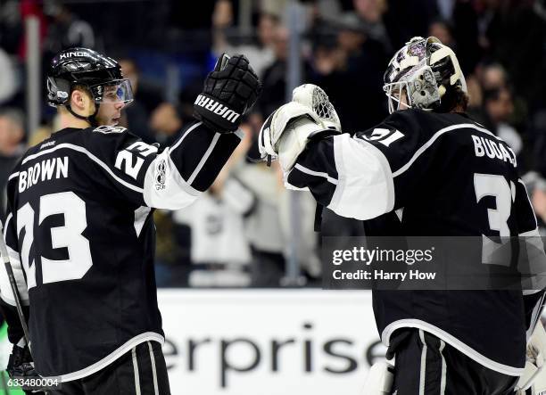 Peter Budaj of the Los Angeles Kings celebrates a 5-0 shutout win over the Colorado Avalanche with Dustin Brown at Staples Center on February 1, 2017...