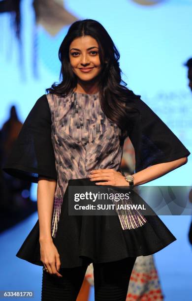 Indian Bollywood actress Kajal Aggarwal poses for a photograph during Lakmé Fashion Week Summer Resort 2017 in Mumbai on late Februsry 1, 2017. / AFP...