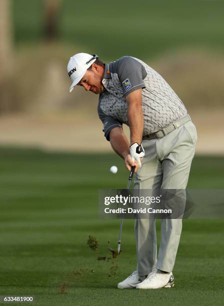 Graeme McDowell of Northern Ireland plays his third shot to the par 5, 10th hole during the first round of the 2017 Omega Dubai Desert Classic on the...