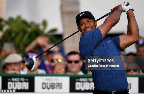 Tiger Woods of the USA hits his opening tee shot on the par five 10th hole during the first round of the Omega Dubai Desert Classic at Emirates Golf...