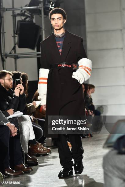 Model walks the runway at the Raf Simons show during NYFW: Men's on February 1, 2017 in New York City.