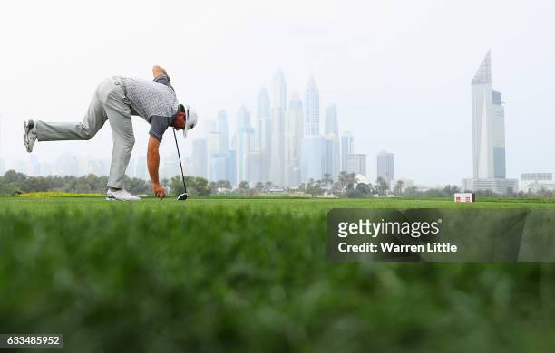 Graeme McDowell of Northern Ireland tees off on the 8th hole during the first round of the Omega Dubai Desert Classic at Emirates Golf Club on...