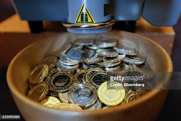 Machine weighs and counts samples of coins at the opening of the Trial of the Pyx at Goldsmiths' Hall in London, U.K., on Tuesday, Jan. 31, 2017. In...