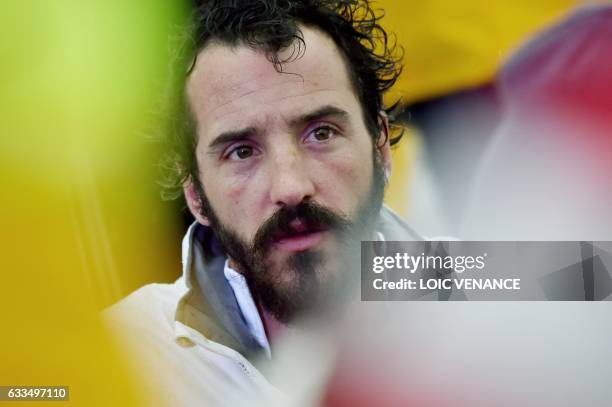 French skipper Louis Burton celebrates aboard his Imoca monohull "Bureau Vallee" as he arrives in Les Sables-d'Olonne, western France, after placing...