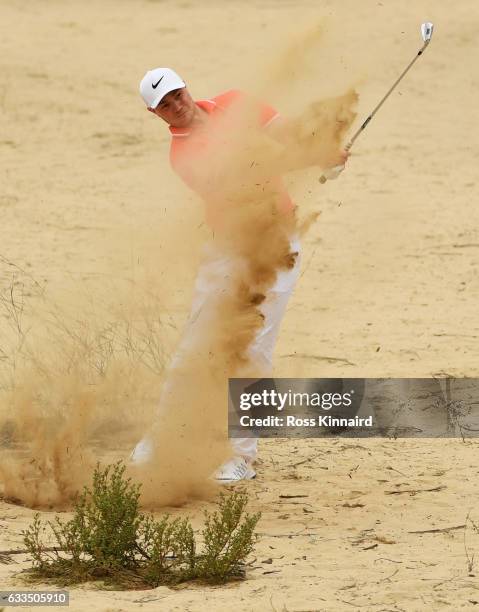 Oliver Fisher of England plays his second shot on the 13th hole during the first round of the Omega Dubai Desert Classic at Emirates Golf Club on...