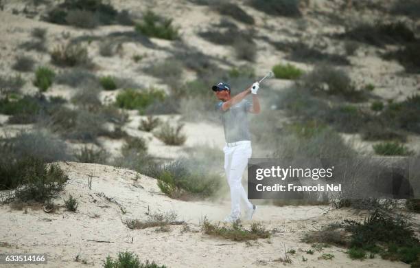 Nicolas Colsaerts of Belgium plays a shot on the 8th hole during the first round of the Omega Dubai Desert Classic at Emirates Golf Club on February...