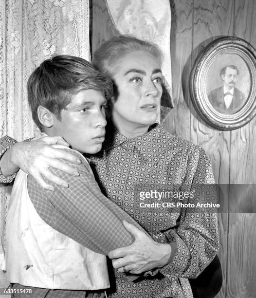 Dick Powells Zane Grey Theater production of the episode Rebel Ranger featuring from left: Don Grady and Joan Crawford . Image dated October 16,...