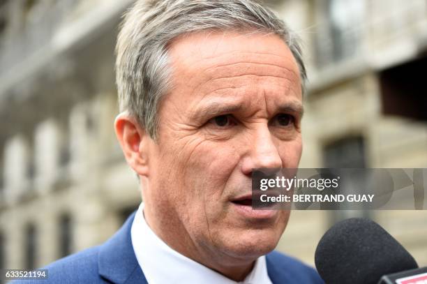 Right-wing independent presidential candidate Nicolas Dupont-Aignan answers journalists questions prior to the trial for demafation of a former UBS...
