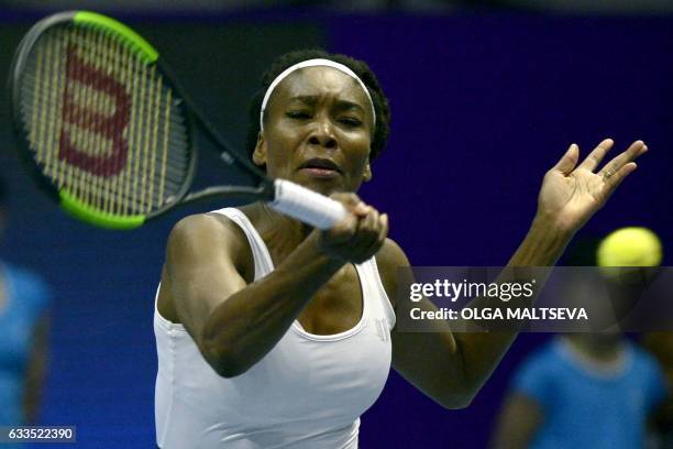 Venus Williams hits a return against France's Kristina Mladenovic during the second round of the WTA St Petersburg Ladies Trophy 2017 tennis...