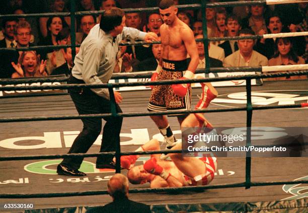 Prince Naseem Hamed , watched by referee Paul Thomas, enroute to his first round victory over Billy Hardy during their WBO and IBF featherweight...