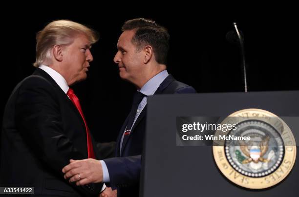 President Donald Trump greets television producer Mark Burnett after Burnett introduced Trump at the National Prayer Breakfast February 2, 2017 in...