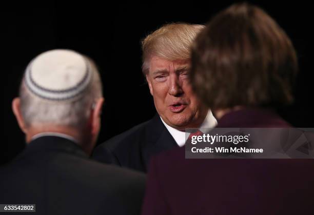 President Donald Trump greets members of the head table while arriving at the National Prayer Breakfast February 2, 2017 in Washington, DC. Every...