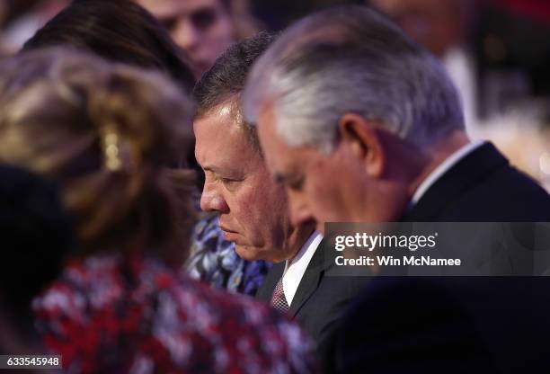 Jordan's King Abdullah and U.S. Secretary of State Rex Tillerson listen to remarks at the National Prayer Breakfast where U.S. President Donald Trump...