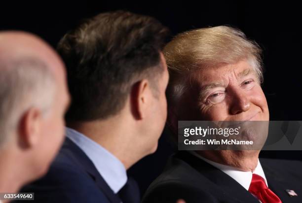 President Donald Trump speaks with members of the head table at the National Prayer Breakfast February 2, 2017 in Washington, DC. Every U.S....