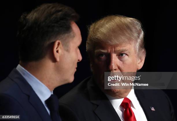 President Donald Trump talks with television producer Mark Burnett at the National Prayer Breakfast February 2, 2017 in Washington, DC. Every U.S....