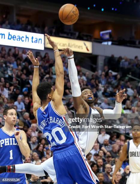 Dallas Mavericks guard Wesley Matthews, right, gets fouled by Philadelphia 76ers guard Timothe Luwawu-Cabarrot during the first half on Wednesday,...