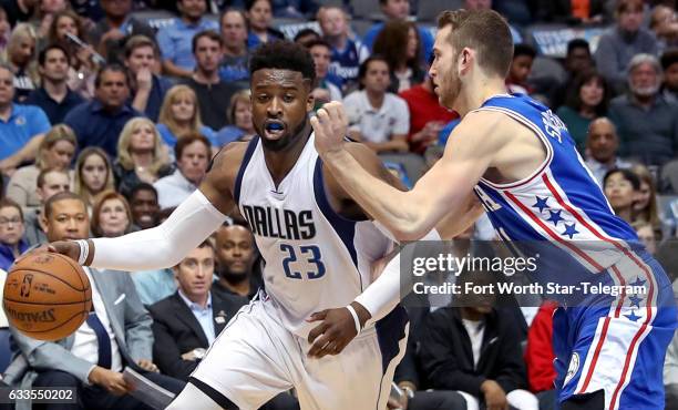 Dallas Mavericks guard Wesley Matthews tries to get around Philadelphia 76ers' Nik Stauskas, right, during the first half on Wednesday, Feb. 1, 2017...