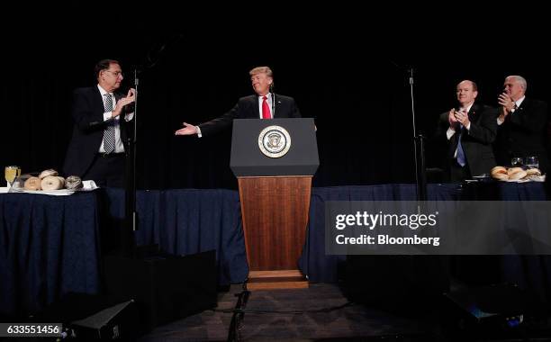 President Donald Trump, center, gestures during the National Prayer Breakfast in Washington, D.C., U.S., on Thursday, Feb. 2, 2017. For the first...