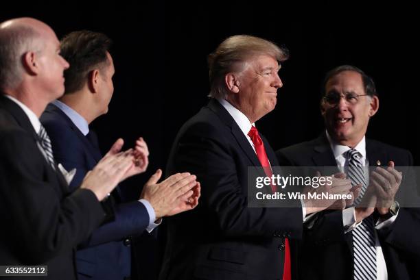 President Donald Trump applauds at the National Prayer Breakfast February 2, 2017 in Washington, DC. Every U.S. President since Dwight Eisenhower has...