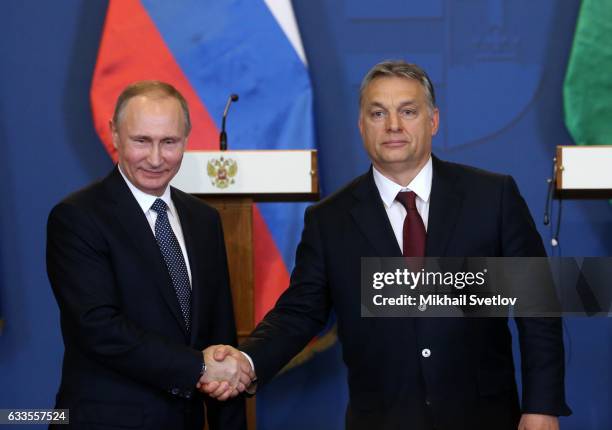 Russian President Vladimir Putin shakes hands with Hungarian Prime Minister Viktor Orban during their joint press conference February 2, 2017 in...