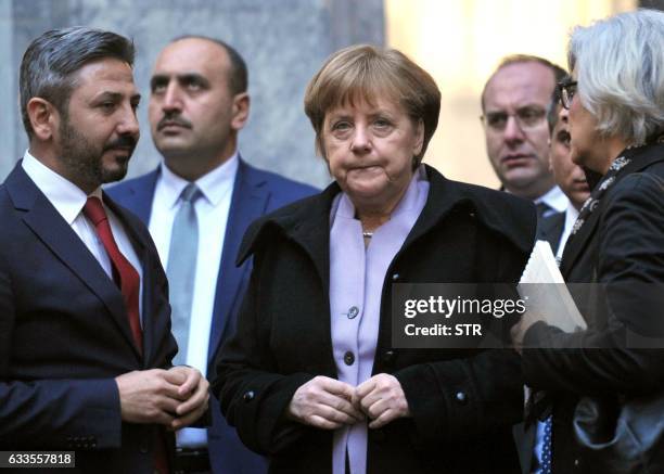 German Chancellor Angela Merkel and Ahmet Aydin , Deputy Speaker of the Turkish Grand National Assembly, visit a part of the Turkish Parliament...