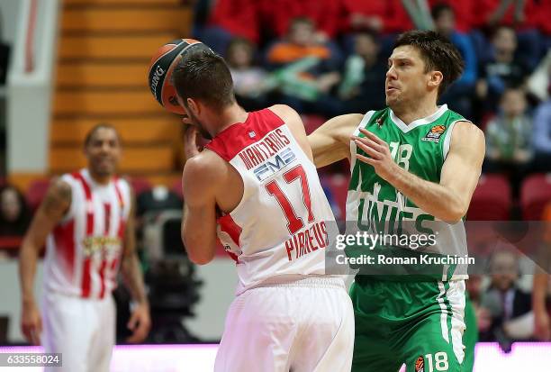 Vangelis Mantzaris, #17 of Olympiacos Piraeus competes with Evgeny Voronov, #18 of Unics Kazan during the 2016/2017 Turkish Airlines EuroLeague...