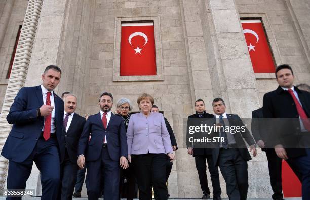 German Chancellor Angela Merkel and Ahmet Aydin , Deputy Speaker of the Turkish Grand National Assembly, visit a part of the Turkish Parliament...