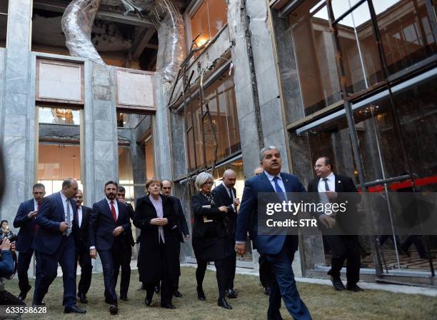 German Chancellor Angela Merkel and Ahmet Aydin , Deputy Speaker of the Turkish Grand National Assembly, visit a part of the Turkish Parliament...