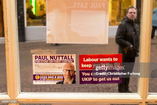 Man reads UKIP election posters in Hanley on February 2, 2017 in Stoke-on-Trent, England. The Stoke-On-Trent central by-election has been called...