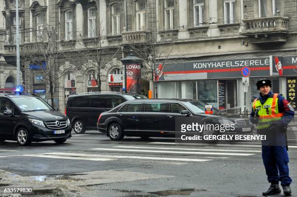 Russian President Vladimir Putin sits in his car prior to a meeting with Hungarian Prime Minister Viktor Orban during his one-day visit, in Budapest,...