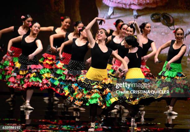 Flamenco dancers of the Cordoba Dance School perform wearing creations by Pilar Vera during the SIMOF 2017 in Sevilla on February 2, 2017 / AFP /...