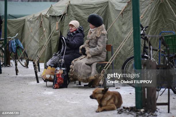 Elderly local residents in the flashpoint eastern town of Avdiivka, that sits just north of the pro-Russian rebels' de facto capital of Donetsk,...