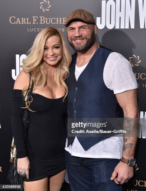 Actor/retired mixed martial artist Randy Couture and actress/model Mindy Robinson arrive at the Los Angeles premiere of Summit Entertainment's 'John...