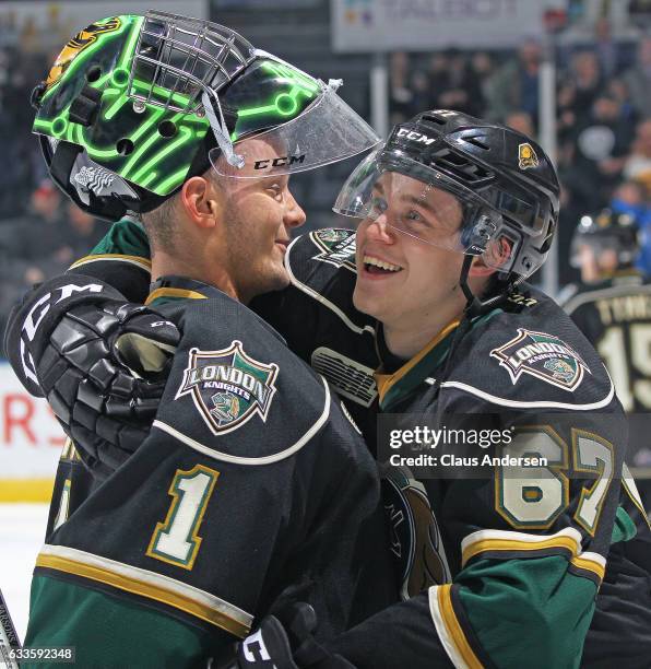 Tyler Parsons and Mitchell Stephens of the London Knights celebrate a victory against the Kitchener Rangers in an OHL game at Budweiser Gardens on...