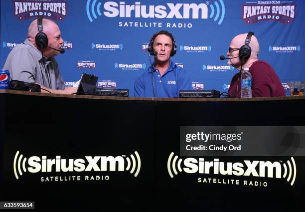 Former NFL player Doug Flutie, center, visits the SiriusXM set at Super Bowl 51 Radio Row at the George R. Brown Convention Center on February 2,...