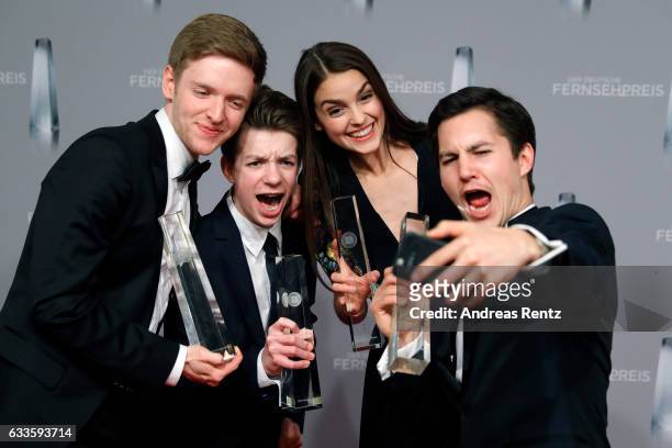 Timur Bartels, Nick Julius Schuck, Luise Befort and Ivo Kortland of 'Club der Roten Baender' take a selfie with their awards at the German Television...
