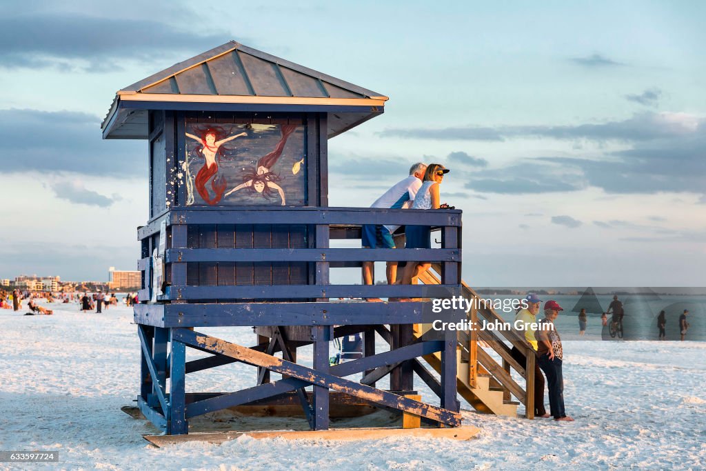 Tourists enjoy sunset view at Siesta Key Beach...